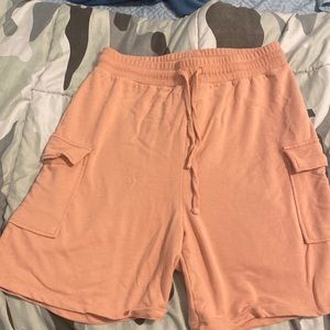 Salmon coloured long pink shorts
